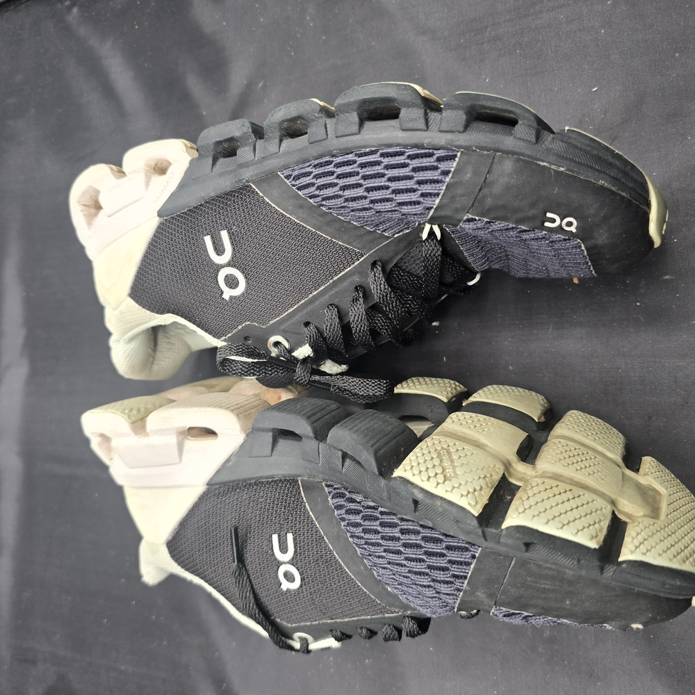 On Running Black and Cream Sneakers with Mesh Design